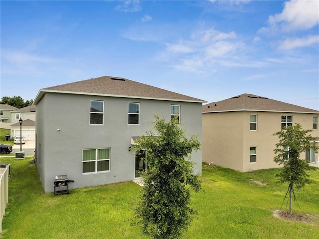 2023 Maple Ridge Dr, Zellwood, FL 32798 - rear view of property featuring stucco siding and a lawn