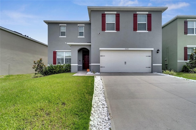 2023 Maple Ridge Dr, Zellwood, FL 32798 - traditional home featuring stucco siding, concrete driveway, a front yard, and a garage