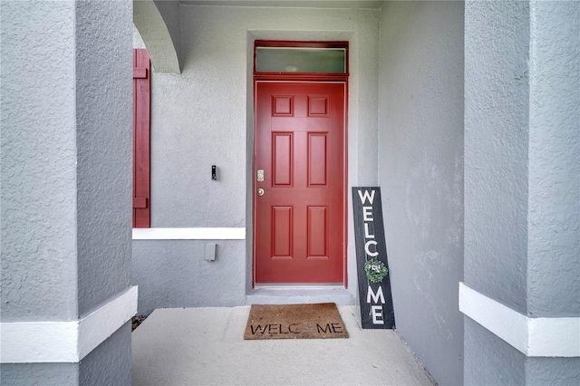 2023 Maple Ridge Dr, Zellwood, FL 32798 - view of exterior entry featuring stucco siding