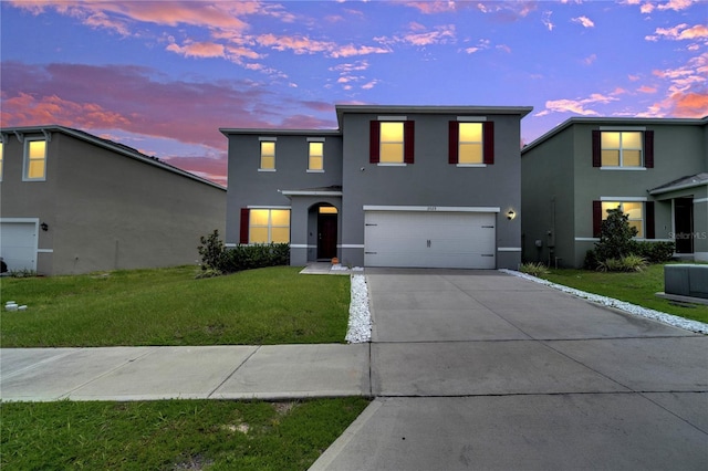 2023 Maple Ridge Dr, Zellwood, FL 32798 - traditional home with stucco siding, driveway, an attached garage, and a lawn
