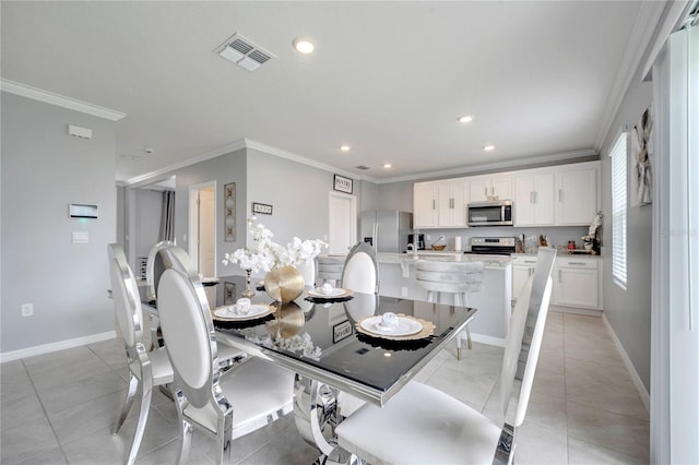 2023 Maple Ridge Dr, Zellwood, FL 32798 - dining room featuring ornamental molding, recessed lighting, and light tile patterned flooring