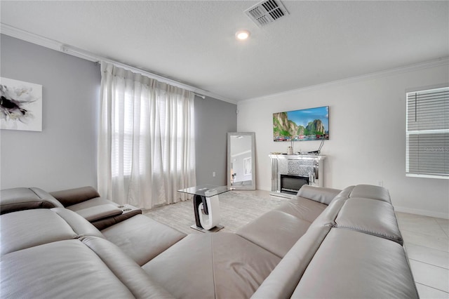 2023 Maple Ridge Dr, Zellwood, FL 32798 - living room featuring crown molding, a glass covered fireplace, and light tile patterned floors