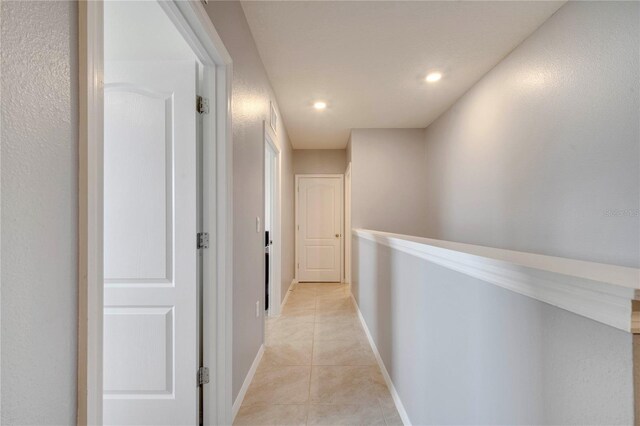 2023 Maple Ridge Dr, Zellwood, FL 32798 - hallway with light tile patterned floors and recessed lighting