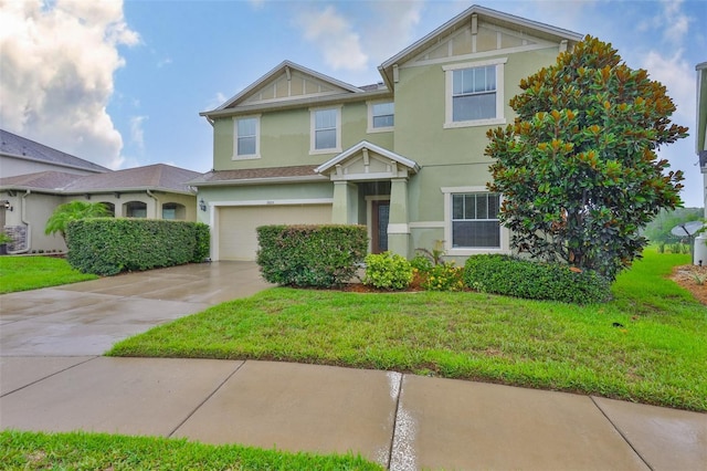 2605 Stardale Way, Lutz, FL 33558 - view of front facade with driveway, an attached garage, stucco siding, and a front lawn