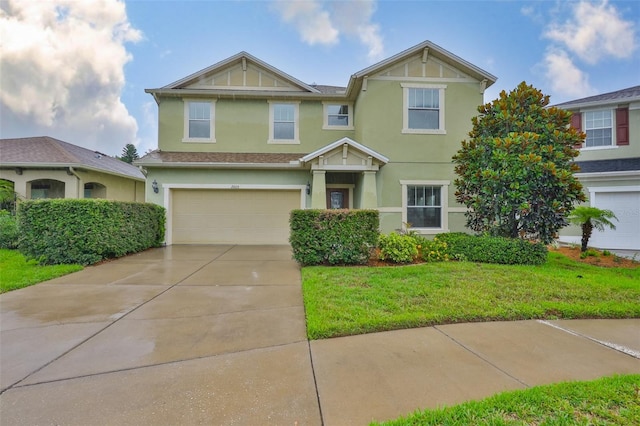 2605 Stardale Way, Lutz, FL 33558 - view of front of home with stucco siding, an attached garage, concrete driveway, and a front lawn