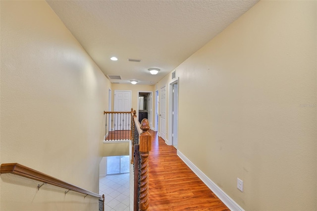 2605 Stardale Way, Lutz, FL 33558 - hall with an upstairs landing and wood finished floors