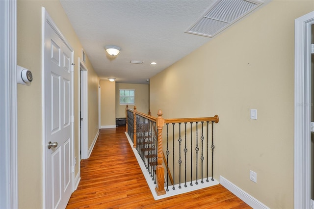 2605 Stardale Way, Lutz, FL 33558 - corridor with an upstairs landing and wood finished floors