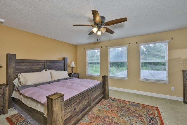 2605 Stardale Way, Lutz, FL 33558 - bedroom featuring light colored carpet, a ceiling fan, and a textured ceiling