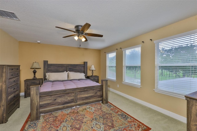 2605 Stardale Way, Lutz, FL 33558 - carpeted bedroom with a ceiling fan and a textured ceiling