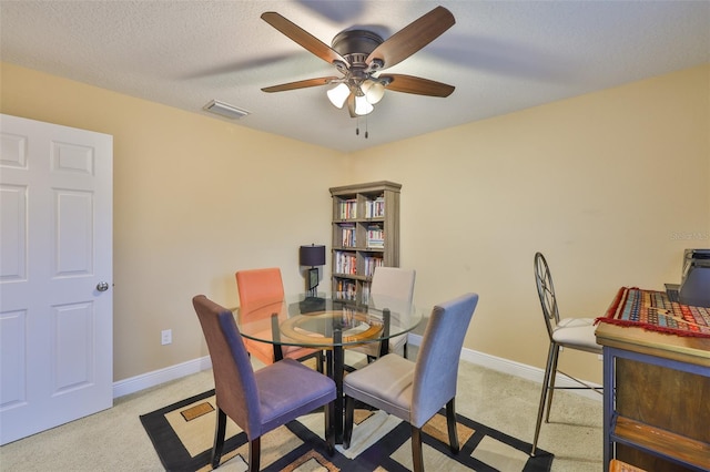 2605 Stardale Way, Lutz, FL 33558 - carpeted dining area featuring ceiling fan and a textured ceiling