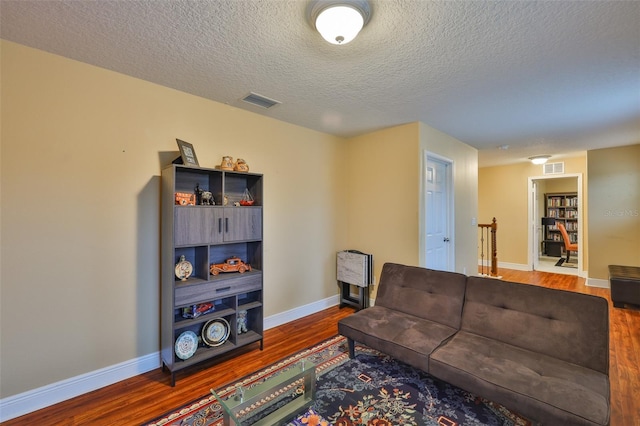 2605 Stardale Way, Lutz, FL 33558 - living area featuring wood finished floors and a textured ceiling