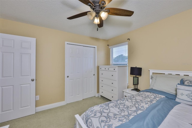 2605 Stardale Way, Lutz, FL 33558 - carpeted bedroom featuring a closet, a textured ceiling, and a ceiling fan