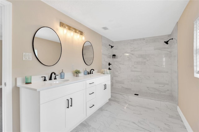 4723 Bloomingdale Ave, Valrico, FL 33596 - full bathroom with double vanity, marble look tiles, and a tile shower