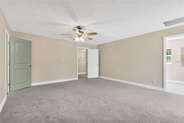4723 Bloomingdale Ave, Valrico, FL 33596 - carpeted spare room featuring a ceiling fan and a textured ceiling
