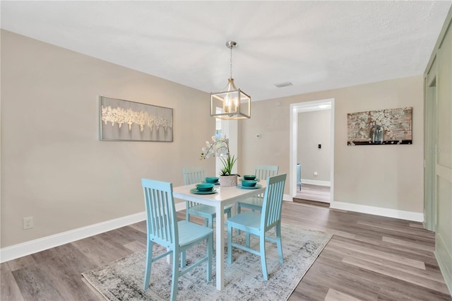 4723 Bloomingdale Ave, Valrico, FL 33596 - dining room with a chandelier and wood finished floors