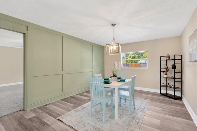 4723 Bloomingdale Ave, Valrico, FL 33596 - dining space with a chandelier and light wood finished floors