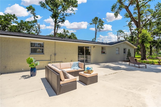 4723 Bloomingdale Ave, Valrico, FL 33596 - rear view of house featuring stucco siding, a patio, and outdoor lounge area