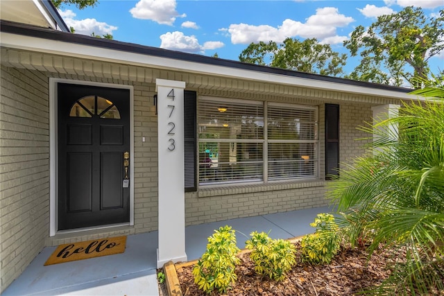 4723 Bloomingdale Ave, Valrico, FL 33596 - entrance to property featuring brick siding and a porch