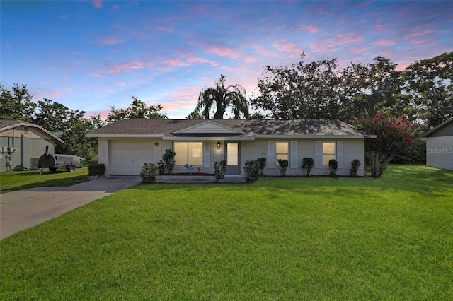 923 April Hills Blvd, Lady Lake, FL 32159 - single story home with driveway, an attached garage, and a yard