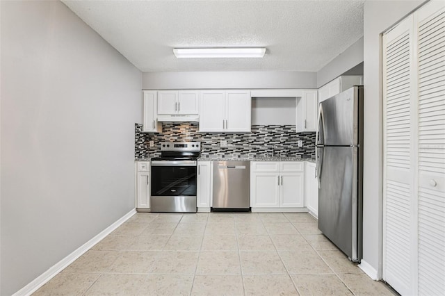 923 April Hills Blvd, Lady Lake, FL 32159 - kitchen featuring stainless steel appliances, backsplash, white cabinets, a textured ceiling, and under cabinet range hood