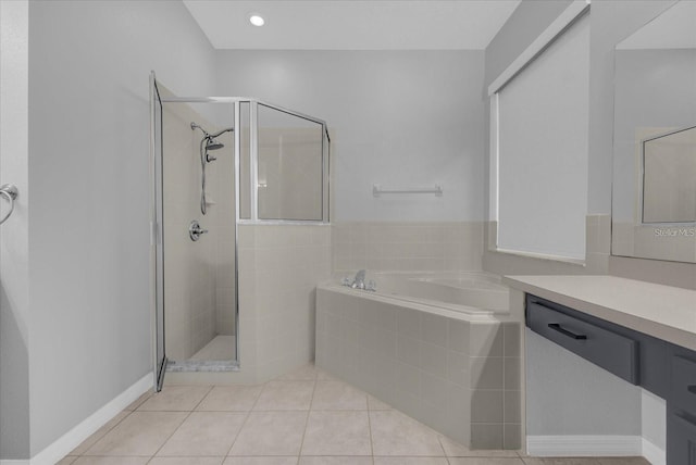 320 Tupelo Cir, Davenport, FL 33897 - full bath with a bath, a shower stall, vanity, and tile patterned flooring