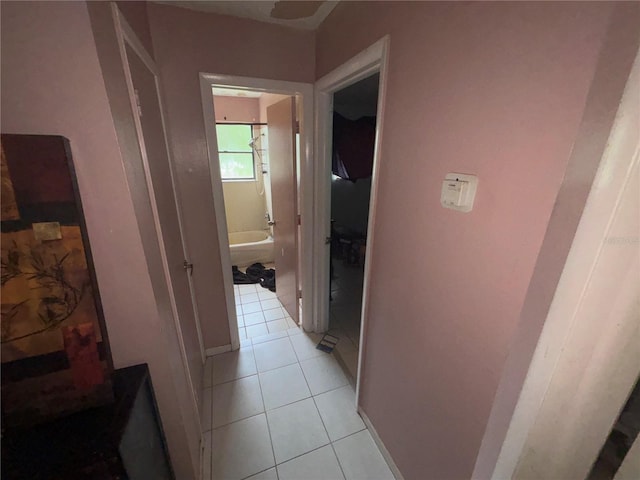 16107 Sea Pines Dr, Hudson, FL 34667 - hallway featuring light tile patterned floors