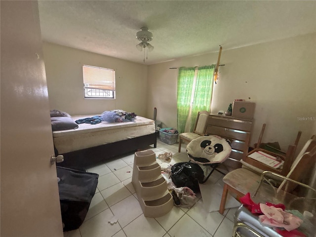 16107 Sea Pines Dr, Hudson, FL 34667 - tiled bedroom with a textured ceiling