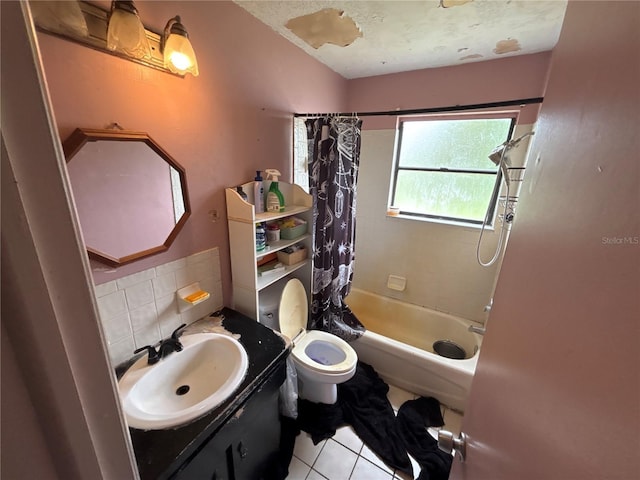 16107 Sea Pines Dr, Hudson, FL 34667 - bathroom featuring tile patterned flooring, shower / tub combo with curtain, vanity, and decorative backsplash