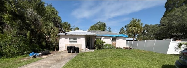 16107 Sea Pines Dr, Hudson, FL 34667 - rear view of house with stucco siding