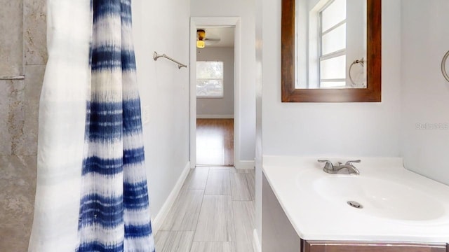 8609 N 11th St, Tampa, FL 33604 - bathroom featuring vanity and baseboards