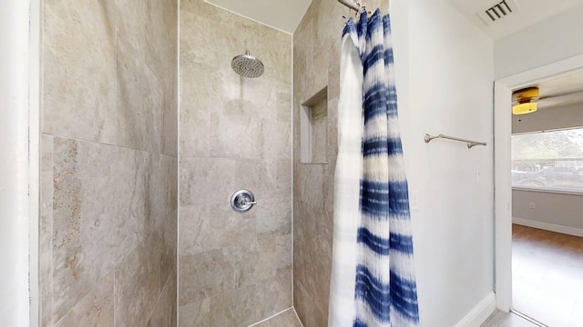 8609 N 11th St, Tampa, FL 33604 - bathroom with tiled shower and baseboards