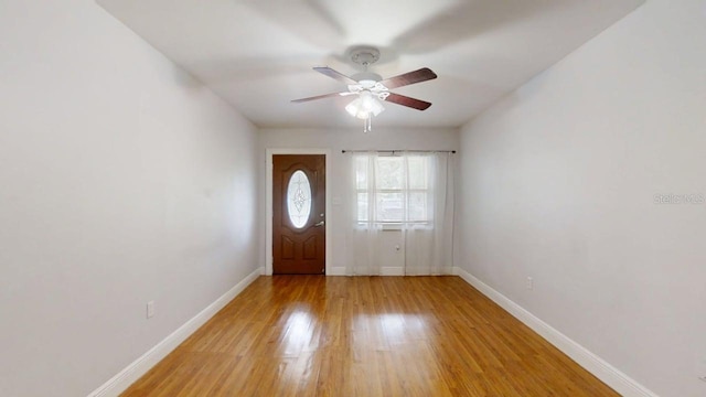 8609 N 11th St, Tampa, FL 33604 - foyer entrance featuring a ceiling fan and light wood-style floors