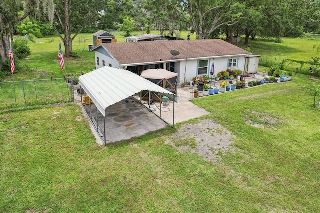127 Locke Rd, Davenport, FL 33837 - back of house with a patio area, a gazebo, and view of scattered trees
