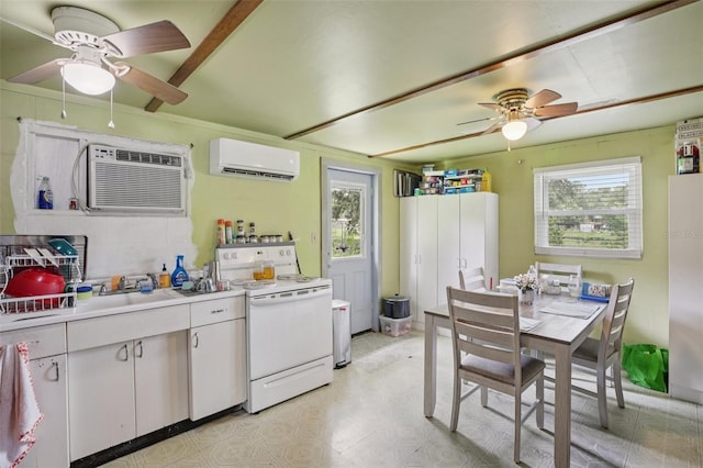 127 Locke Rd, Davenport, FL 33837 - kitchen with white electric stove, ceiling fan, and an AC wall unit