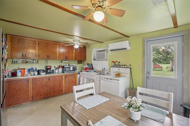 127 Locke Rd, Davenport, FL 33837 - kitchen featuring stainless steel microwave, white electric range oven, a wall unit AC, brown cabinetry, and ceiling fan