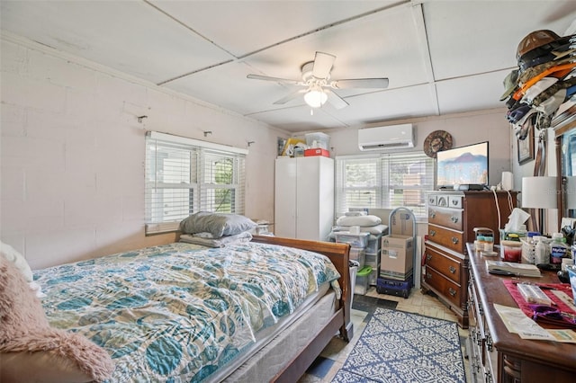 127 Locke Rd, Davenport, FL 33837 - bedroom with a wall mounted AC, concrete block wall, and ceiling fan