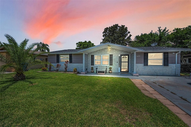 6053 11th Ave, New Port Richey, FL 34653 - ranch-style home with a lawn and stone siding