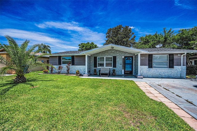 6053 11th Ave, New Port Richey, FL 34653 - single story home featuring stone siding, a front lawn, and a porch