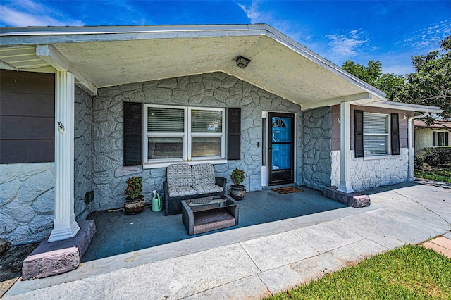 6053 11th Ave, New Port Richey, FL 34653 - view of exterior entry featuring stone siding