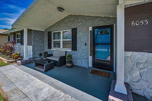 6053 11th Ave, New Port Richey, FL 34653 - entrance to property featuring a porch and stone siding
