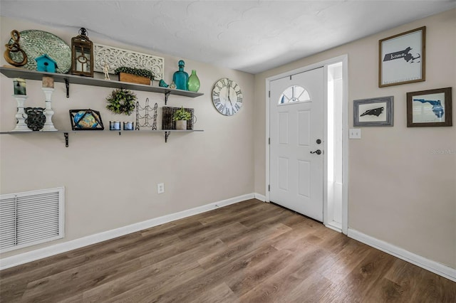 6053 11th Ave, New Port Richey, FL 34653 - entryway with wood finished floors