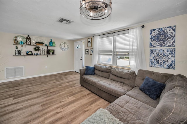 6053 11th Ave, New Port Richey, FL 34653 - living room featuring wood finished floors and baseboards
