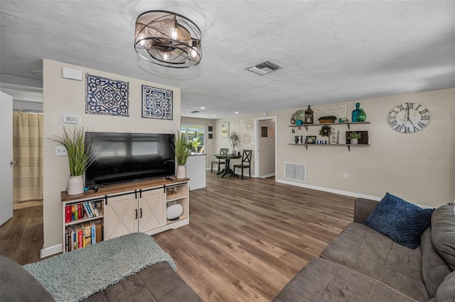 6053 11th Ave, New Port Richey, FL 34653 - living room with wood finished floors and recessed lighting