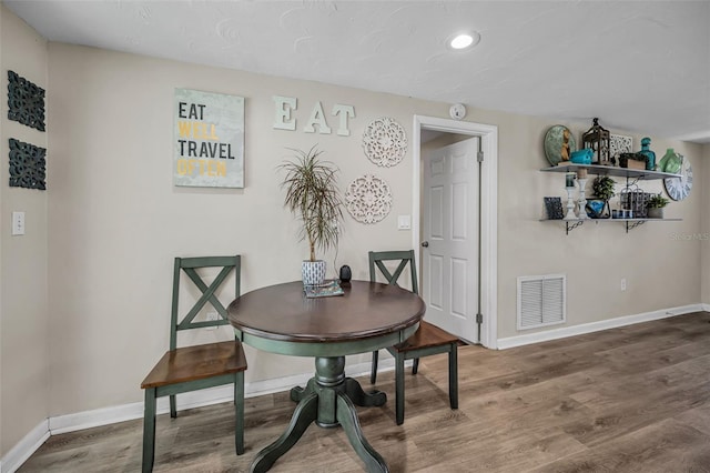6053 11th Ave, New Port Richey, FL 34653 - dining room featuring wood finished floors and recessed lighting
