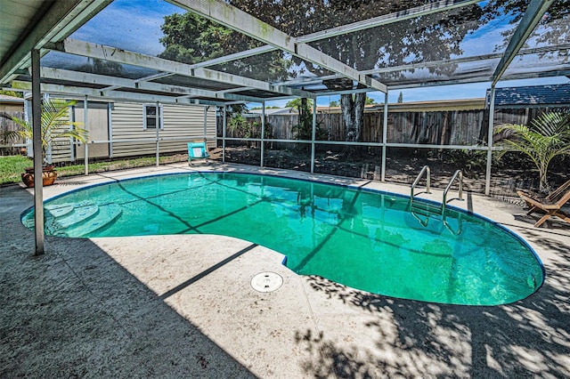 6053 11th Ave, New Port Richey, FL 34653 - view of pool with a fenced backyard, a patio area, and a lanai