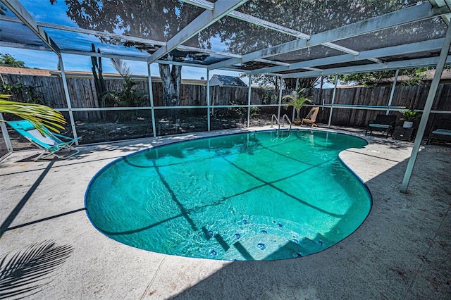 6053 11th Ave, New Port Richey, FL 34653 - view of pool with a fenced backyard, a patio, and glass enclosure
