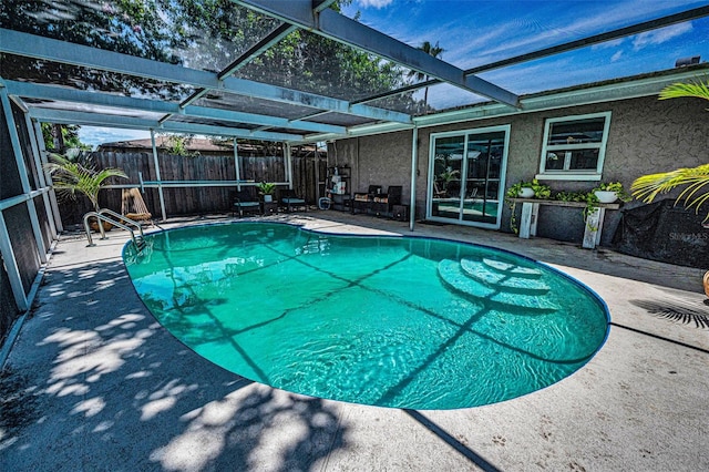 6053 11th Ave, New Port Richey, FL 34653 - view of pool with a fenced backyard, a patio, and glass enclosure