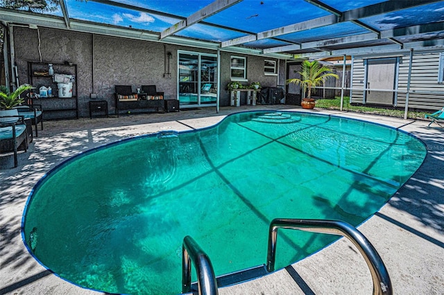 6053 11th Ave, New Port Richey, FL 34653 - swimming pool featuring a patio area and glass enclosure
