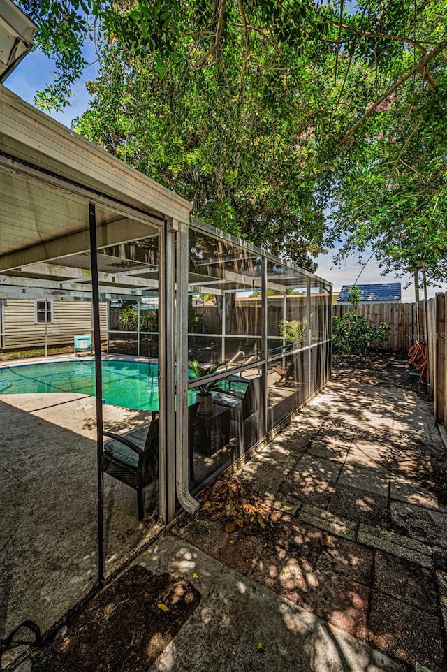 6053 11th Ave, New Port Richey, FL 34653 - view of swimming pool featuring a fenced backyard and a patio area