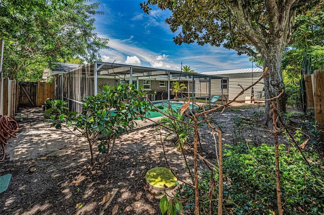 6053 11th Ave, New Port Richey, FL 34653 - fenced backyard featuring a lanai and an outdoor pool